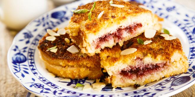 french toast with almonds and a cranberry sauce